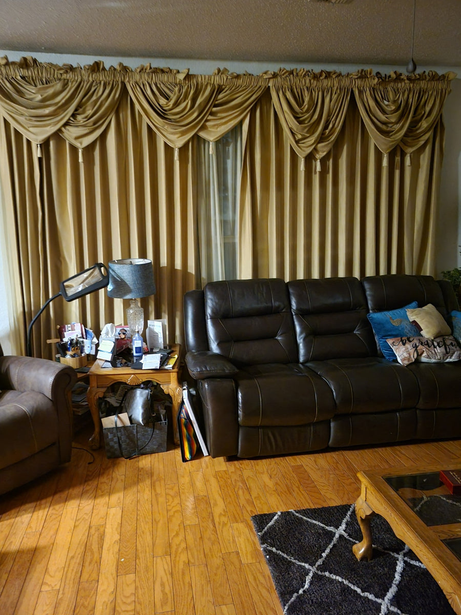 Living room windows before the Zebra Gold shade installation